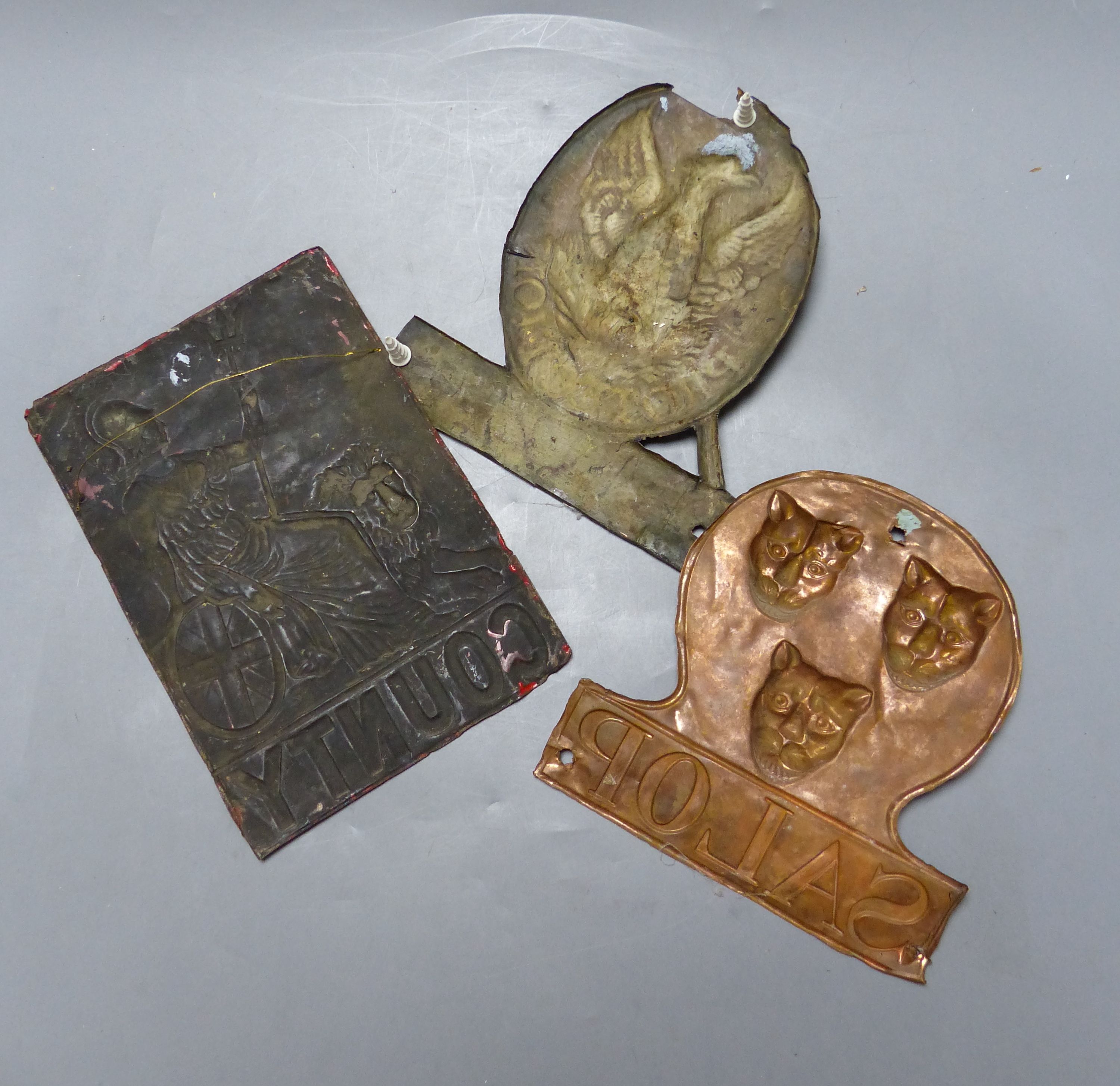 Three embossed tinplate fire marks - 'County' 'Salop' and 'Eagle'